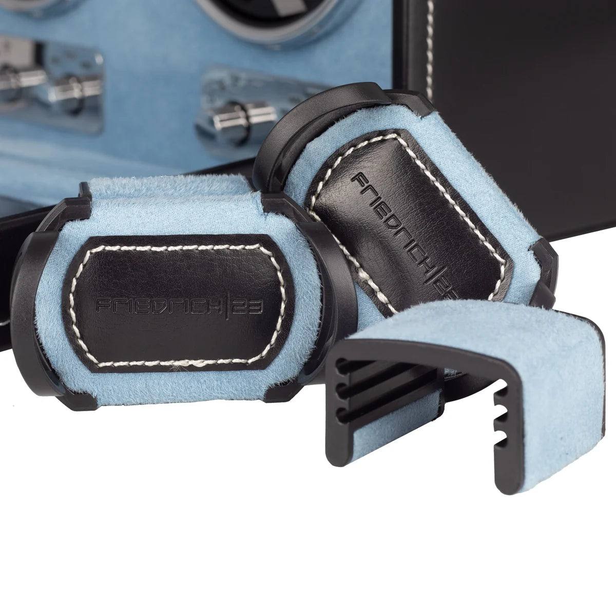 Remontoir à montre automatique Friedrich 23 noir et bleu clair, zoom sur les supports à montre. Sur fond blanc