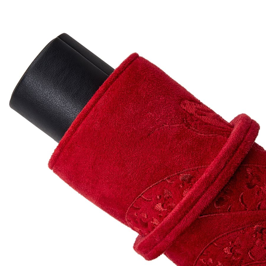 Coussin cylindrique rouge de l’étui montre Lunar, avec broderies décoratives et extrémité noire en cuir